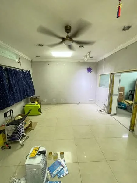 Room features: cream painted walls, glossy tile flooring, ceiling fan, window with blue curtains, light fixture in ceiling, exposed electrical wiring, cardboard boxes, portable air conditioner, open doorway, furniture items in background.