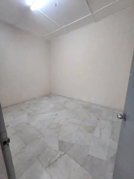 Room features: white painted walls, marble tile flooring, ceiling lights, single door, no visible windows.