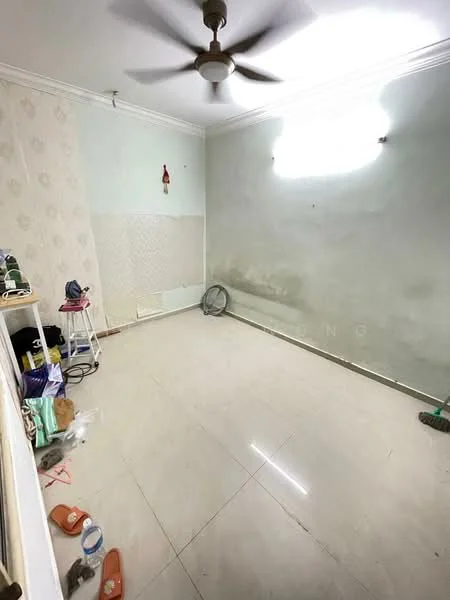 Room features: light green painted walls, white wallpaper with floral pattern, polished tile flooring, ceiling fan, single light fixture, window with natural light, cleaning supplies visible, fan on the floor, empty space, no furniture.