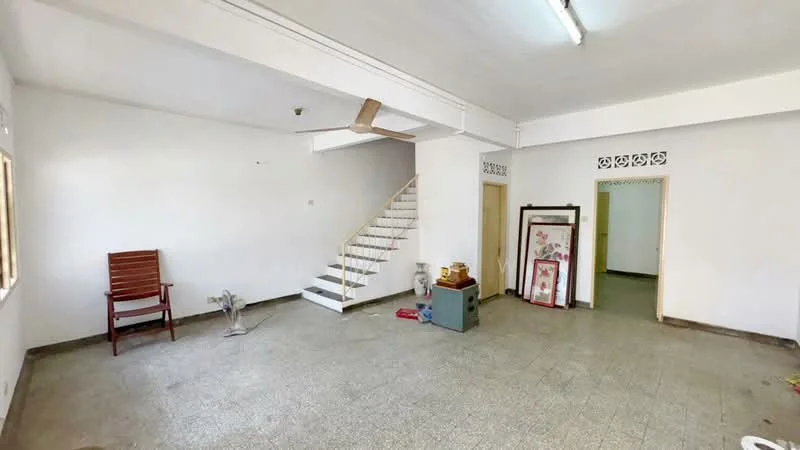Room features: white painted walls, ceiling fan, tile flooring, staircase, large windows, wooden chair, decorative wall panel, doorway leading to another room.
