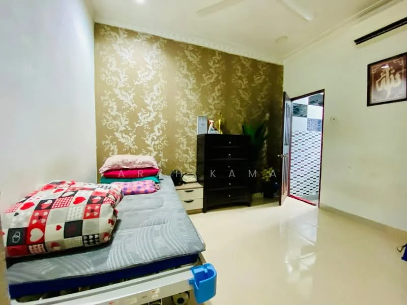 Bedroom features: single bed with patterned bedding, decorative throw pillows, wooden chest of drawers, wall-mounted artwork, cream painted walls, feature wall with floral wallpaper, floor tiles, ceiling fan, green indoor plant, open door leading to hallway; style: modern.