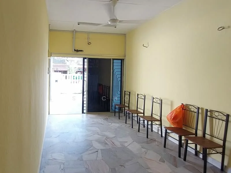 Room features: yellow painted walls, marble flooring, ceiling fan, sliding glass door, multiple wooden chairs, door leading outside, wall-mounted hooks.