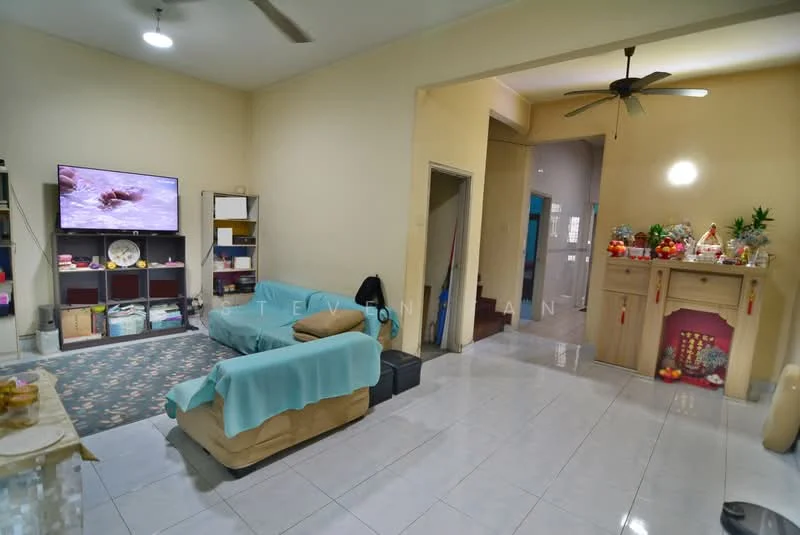 Living features: light-colored painted walls, glossy white tile flooring, 5-blade ceiling fan, sofa with beige upholstery, light blue throw blanket on sofa, wall-mounted TV, decorative shelving unit, area rug with geometric pattern, decorative items on shelves, small table with decorative items; style: modern. Room features: doorway leading to another room, open space leading to hallway.