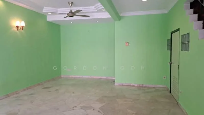 Room features: green painted walls, marble flooring, tray ceiling, ceiling fan, wall-mounted light fixtures, door with ventilation panels, staircase visible in background.