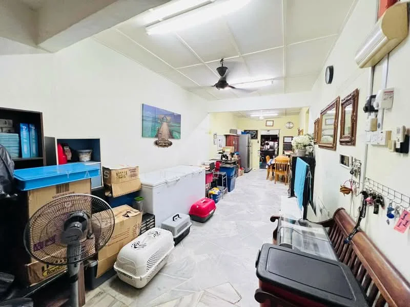 Room features: grey stone flooring, white painted walls, ceiling fan, wall-mounted air conditioning unit, wooden bench, storage cabinets, various boxes, plastic storage containers, pet carrier, refrigerator, kitchen appliances, dining table, decorative wall art.