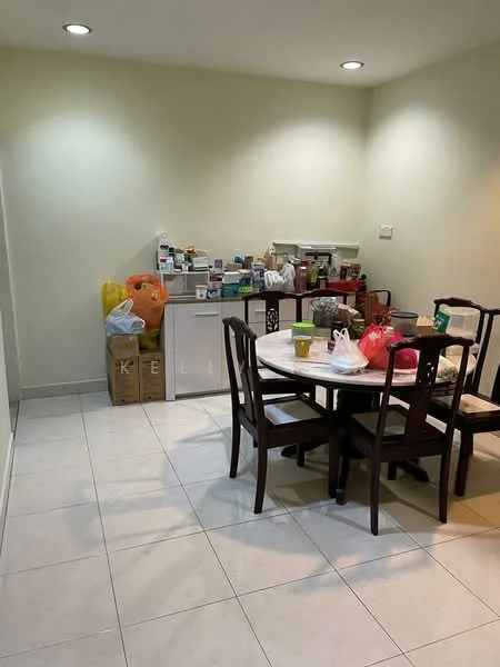 Dining features: round dining table, 4 wooden dining chairs, white tiled flooring, light beige painted walls, recessed downlights, various food items on the table, kitchen appliances on the counter, plastic bags, storage boxes, open shelving with items.