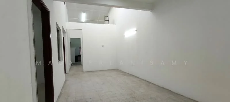 Room features: white painted walls, plain ceiling, tile flooring, fluorescent lighting, open layout, no visible furniture, single door, multiple doorways; style: minimalist.