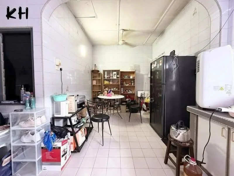 Kitchen features: white tiled walls, white tiled flooring, ceiling fan, black refrigerator, microwave, kitchen countertop, wooden dining table, black dining chairs, open shelving, storage cabinets, various kitchen appliances, multiple containers, decorative items on shelves.