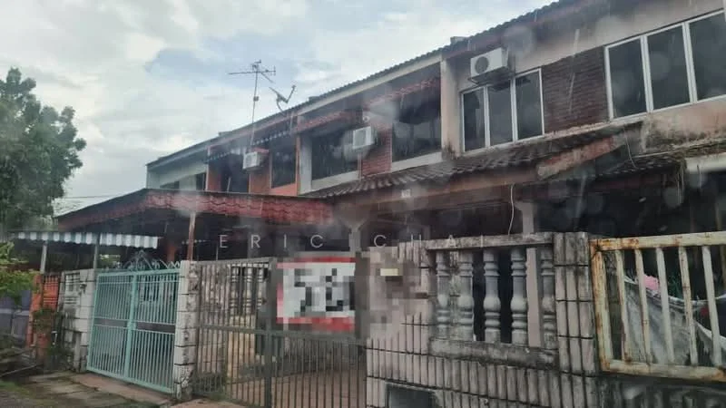 Exterior type: linked terrace house; features: two-storey building, red brick facade, slate roof, metal gate, front porch area, balcony on upper floor, multiple wall-mounted air conditioning units, fenced perimeter, manicured garden area, visible drainage system; style: traditional.