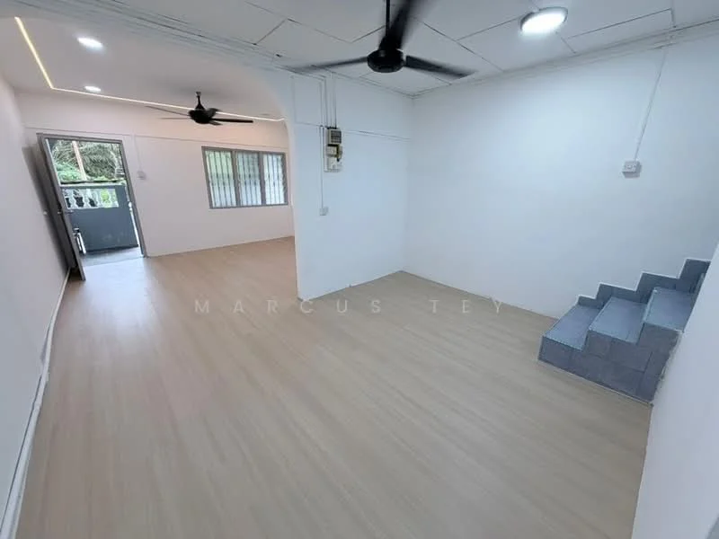 Room features: light wood laminate flooring, white painted walls, ceiling with recessed lighting, 5-blade ceiling fan, large windows for natural light, staircase with grey steps, open layout, door leading to outdoor area; style: modern; view: garden.