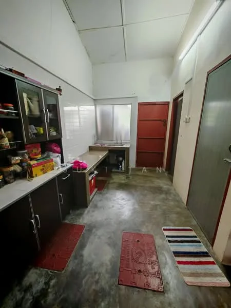Laundry features: grey polished concrete flooring, white painted walls, sliding glass window, wooden countertop, built-in cabinetry with dark finish, sink, red rubber mats, door leading outside.