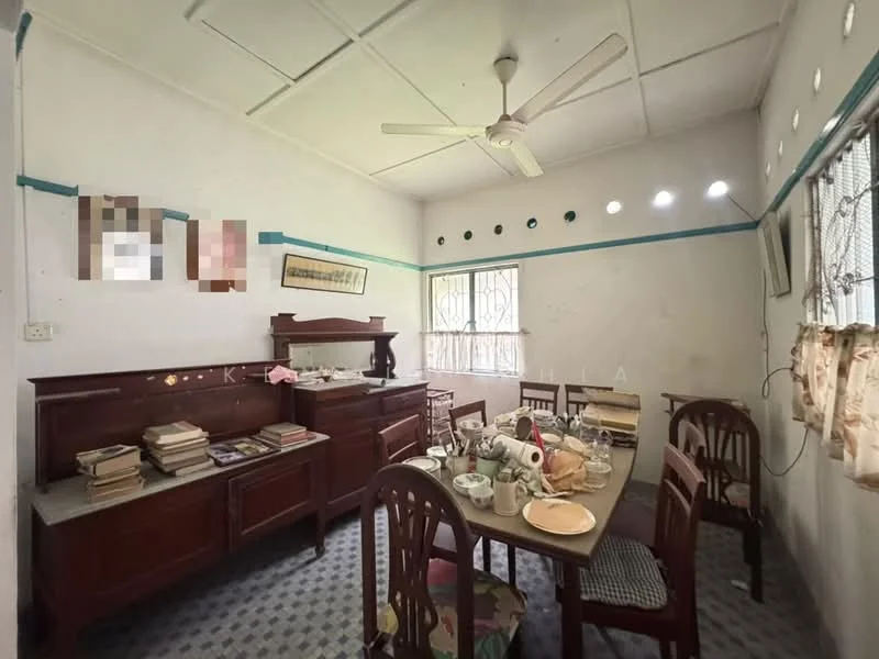 Dining features: wooden dining table, 4 wooden dining chairs, ceiling fan, wall-mounted artwork, wooden sideboard, decorative plates, tableware, grey patterned flooring, window with curtains, white painted walls, blue accent trim; style: traditional.