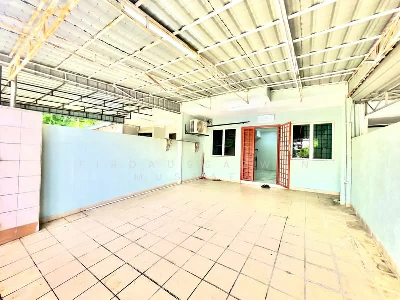 Room features: tiled flooring, light blue painted walls, exposed metal roof, wall-mounted split AC unit, large windows with security bars, double doors leading outside, open layout, no visible furniture.