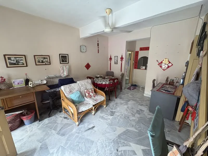 Living features: marble flooring, white painted walls, ceiling fan, wooden coffee table, 2-seater rattan sofa, armchair with cushion, wall-mounted clock, framed photographs, decorative wall hangings, dining table with chairs, open layout to adjacent room; style: traditional.