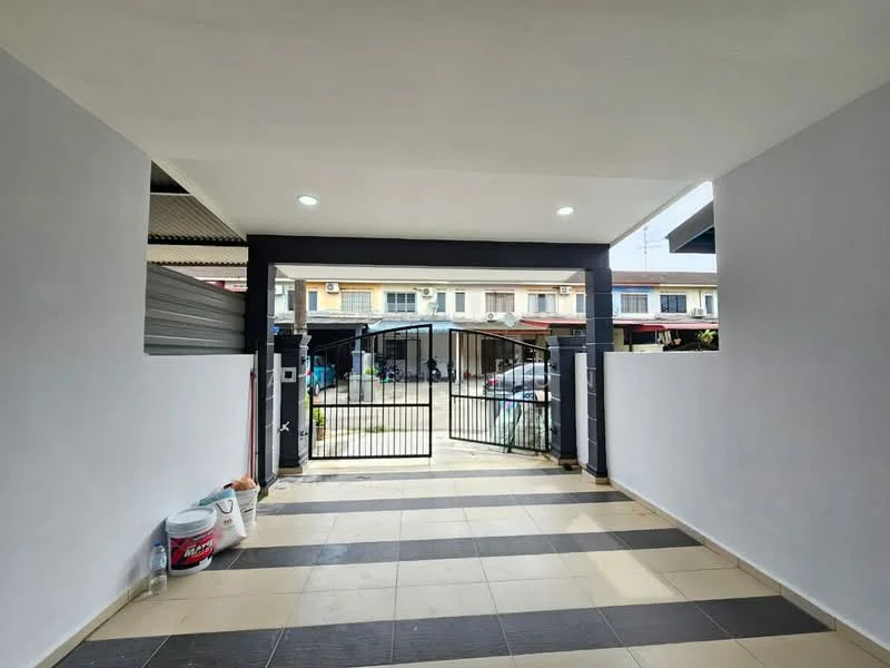 Exterior type: linked terrace house; features: gated entrance, grey painted walls, cream tiled flooring, security gate, open-air car porch, surrounded by residential buildings, manicured landscaping; style: modern.