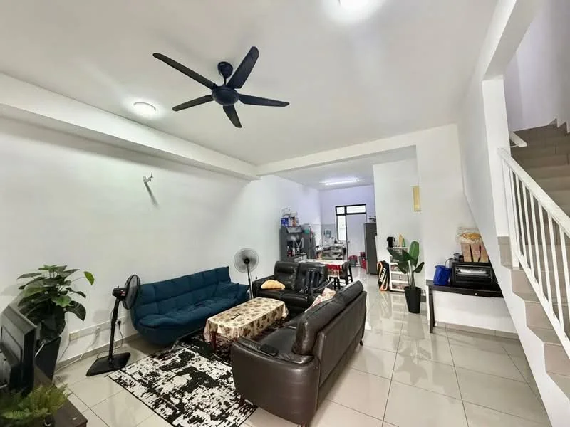 Living features: 5-blade ceiling fan, sofa in dark leather, 3-seater fabric sofa in blue, coffee table, area rug with geometric pattern, wall-mounted TV, TV console, floor tiles in cream, white painted walls, decorative plants in pots, light fixtures in ceiling; style: modern. Room features: staircase leading to upper floor, kitchen area visible in background.