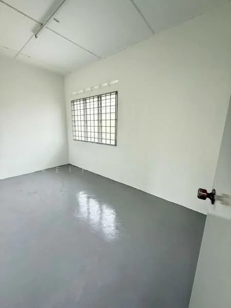 Room features: white painted walls, grey polished concrete flooring, square window with metal grille, plain ceiling, single door with handle; style: minimalist.