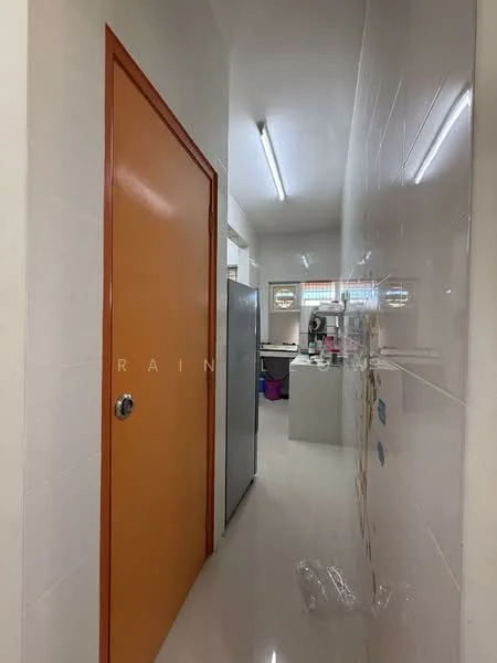 Room features: orange door, stainless-steel fridge, white tiled walls, glossy tile flooring, fluorescent ceiling lights; style: modern.