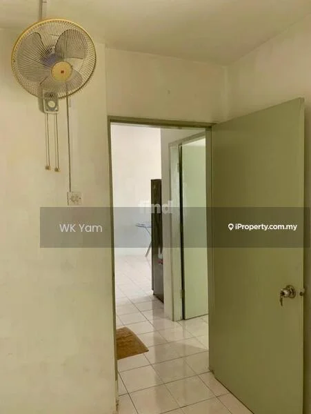 Room features: white painted walls, tile flooring, ceiling fan, green door, door frame, light switch, door handle, door opening to another room.