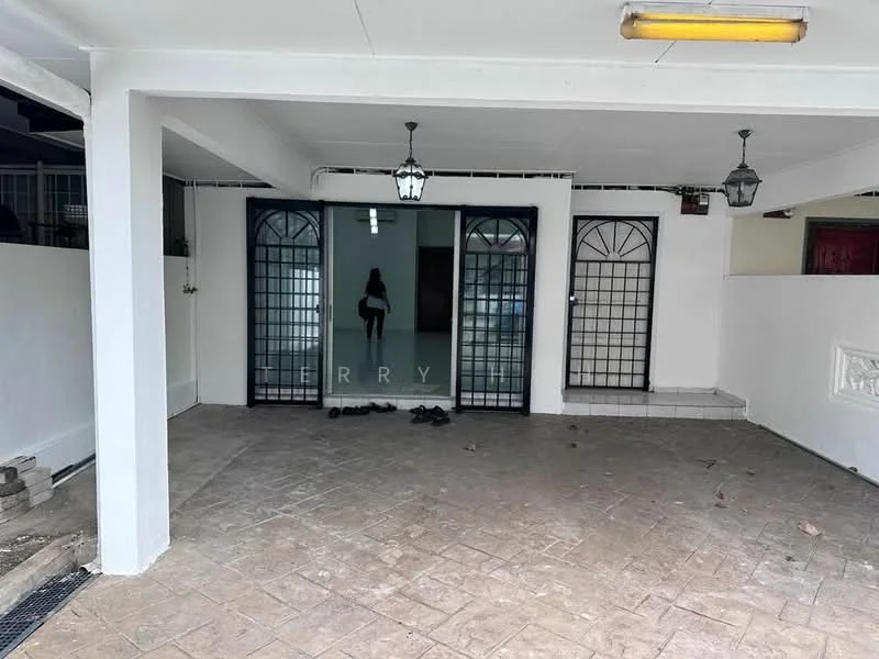 Exterior type: linked terrace house; features: covered car porch, paved flooring, white painted walls, two sets of double doors with decorative grills, outdoor lighting fixtures, open space, surrounded by walls, no visible landscaping; style: modern.
