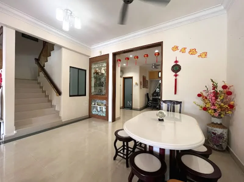 Dining features: round dining table, white table top, wooden dining chairs, decorative wall with floral arrangement, wall-mounted decorative items, cream painted walls, tile flooring, ceiling light fixture, 5-blade ceiling fan, staircase visible in background; style: modern. Hallway features: cream painted walls, tile flooring, staircase with wooden railing, glass door leading to another room, decorative lanterns hanging from ceiling; style: modern.