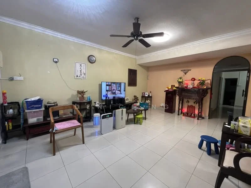 Living features: cream painted walls, white ceiling with crown moulding, 5-blade ceiling fan with light, large flat-screen TV on stand, tile flooring, wooden armchair, small blue stool, wooden table, decorative altar with offerings, air purifier, wall clock, various decorative items on shelves; style: traditional.
