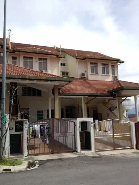 Exterior type: semi-detached house; features: two-storey structure, red tiled roof, cream painted facade, balcony on upper floor, front porch with gate, visible air conditioning units, laundry area with clothes hanging, driveway, surrounded by greenery; style: modern.