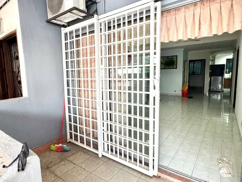 Room features: white security grille door, tiled flooring, grey painted walls, window with sheer curtains, visible living area, open layout, air conditioning unit, light fixtures, cleaning supplies visible; style: modern.