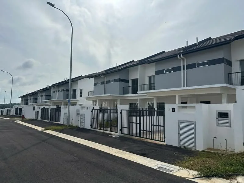 Exterior type: linked terrace house; features: white painted facade, grey accent panels, gated entrance, multiple storeys, balconies on upper floors, manicured landscaping, paved driveway, street lighting, surrounding greenery; style: modern.