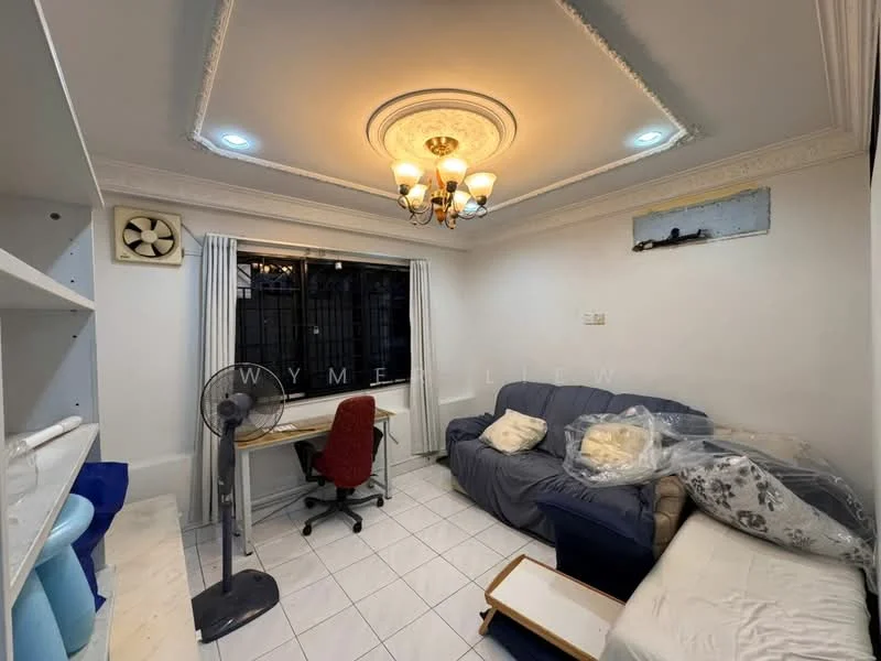 Living features: white painted walls, tile flooring, tray ceiling with chandelier, 5-blade ceiling fan, floor-to-ceiling window with curtains, sofa in beige, blue fabric sofa, desk with red chair, wall-mounted air conditioning unit, open shelving unit, decorative wall molding; style: modern.