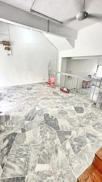 Room features: marble flooring, white painted walls, ceiling fan, metal railing, staircase, natural light from windows, open layout, paint tools visible; style: modern.