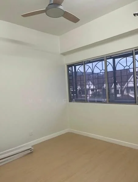 Room features: white painted walls, light wood flooring, 5-blade ceiling fan, large window with grid design, baseboard heating, natural light from window.
