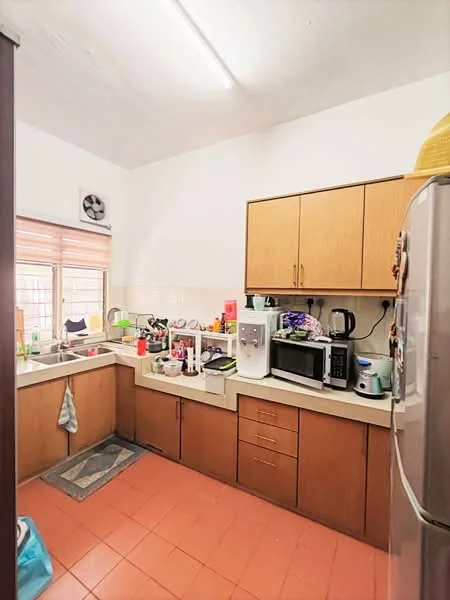 Kitchen features: brown wooden cabinetry, white countertop, single-bowl stainless-steel sink, chrome pull-down faucet, built-in microwave, freestanding range oven, stainless-steel refrigerator, kettle, toaster, dishwasher, tile flooring in orange, window with blinds, wall-mounted split AC, area rug, decorative items on countertop.