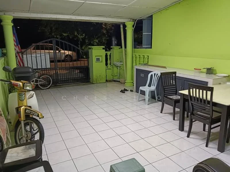 Room features: green painted walls, white tiled flooring, outdoor dining table, four black dining chairs, light-colored kitchen cabinets, countertop, bicycle visible, gate visible in background, outdoor seating area, wall-mounted mailbox, decorative columns; style: modern; view: street.