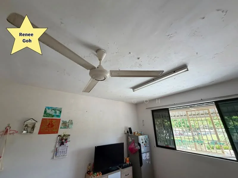 Room features: white painted walls, ceiling fan, window with security grille, television, fridge, decorative wall art, wall-mounted calendar.