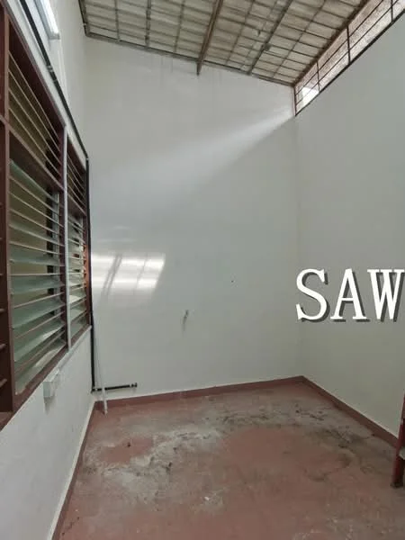 Room features: white painted walls, metal roof, red tile flooring, window with horizontal slats, natural light from window, unfinished floor, no visible furniture or decor.