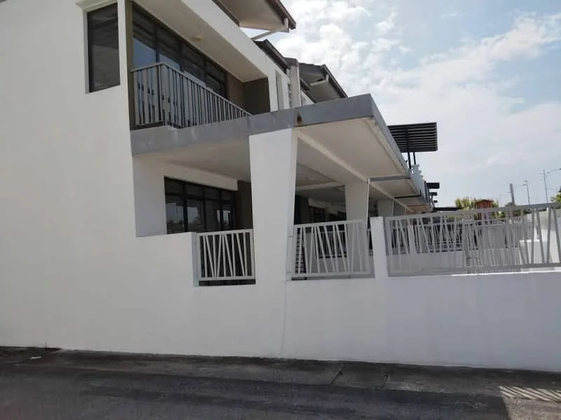 Exterior type: linked terrace house; features: white painted facade, flat roof, two-storey structure, balconies with railings, concrete walls, manicured landscaping, driveway, surrounded by greenery; style: modern.