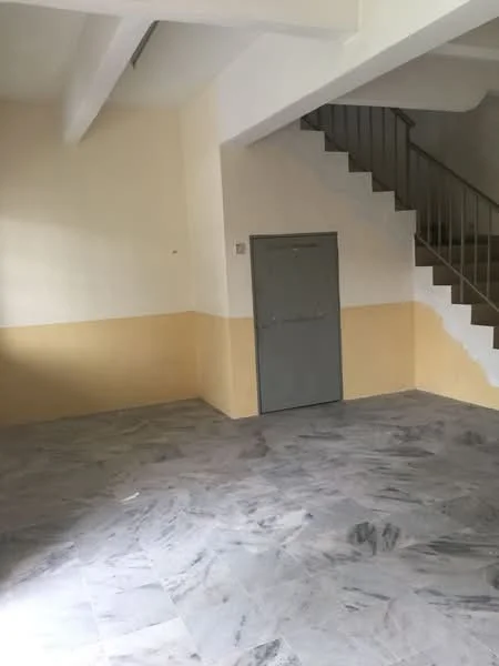 Room features: grey marble flooring, white painted walls, cream painted walls, staircase with metal railing, door with grey finish, high ceiling, natural light from windows, open layout.