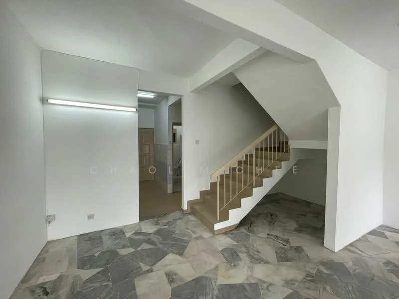 Room features: white painted walls, grey stone flooring, staircase with wooden railing, recessed lighting, open layout, no visible windows, neutral color scheme; style: modern.