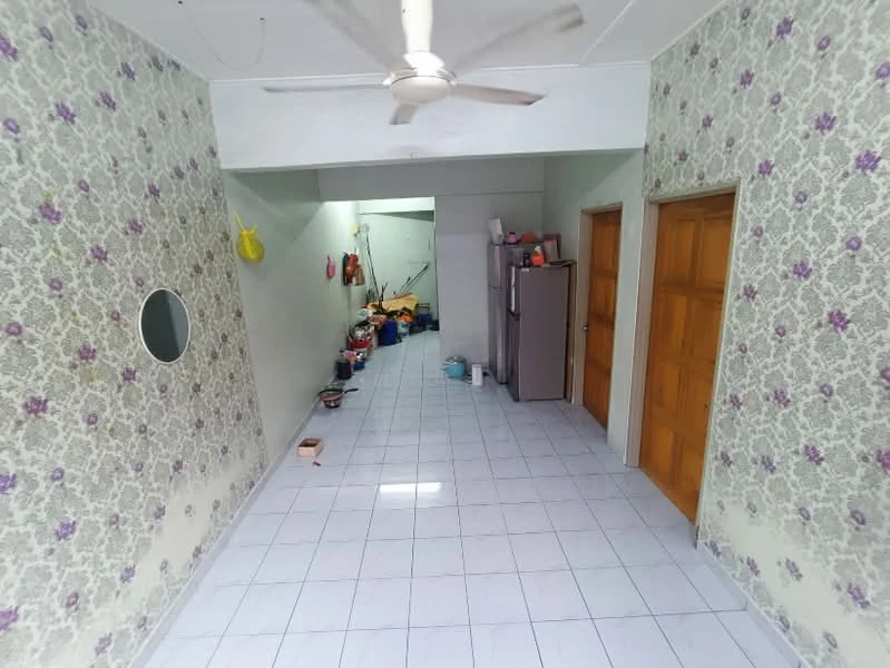 Room features: white tiled flooring, floral wallpaper with purple accents, ceiling fan, wooden doors, round mirror, open layout, visible storage items, kitchen appliances, wall-mounted hooks; style: traditional.