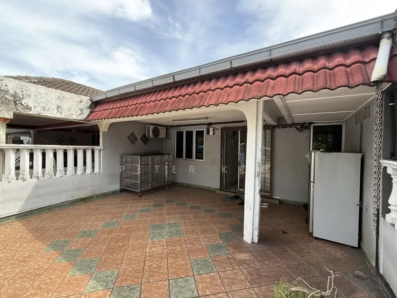 Room features: terracotta tile flooring, red corrugated metal roof, white painted walls, exposed beams, wall-mounted air conditioning unit, outdoor space with railing, fenced area, refrigerator.