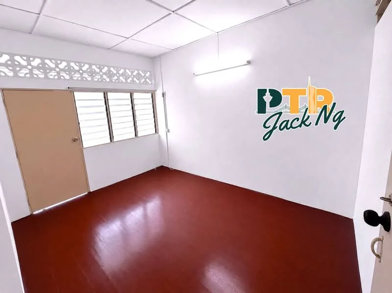 Room features: white painted walls, red laminate flooring, sliding window with grille, single door, ceiling light fixture, plain ceiling, no visible furniture, corner location; style: minimalist.