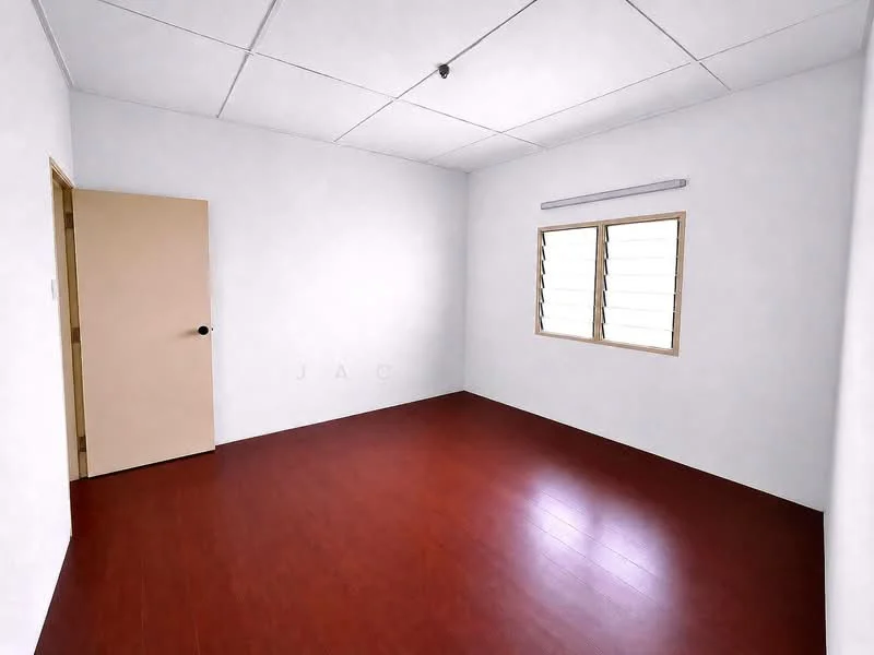 Room features: white painted walls, laminate flooring in reddish-brown, single window with horizontal slats, plain ceiling, light fixture on ceiling, wooden door with handle; style: minimalist.