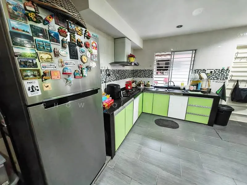 Kitchen features: stainless-steel fridge, black countertop, green cabinetry, white upper cabinets, tile backsplash with black and white pattern, built-in oven, gas hob, kitchen sink, window with blinds, wall-mounted shelf, magnet board with various magnets, ceramic tile flooring, recessed lighting; style: modern.