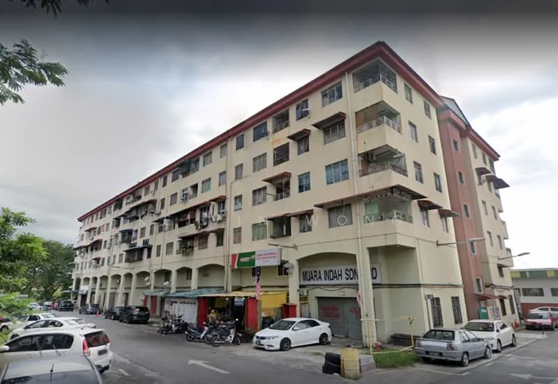 Exterior type: low-rise apartment block; features: cream painted facade, red accent panels, multiple balconies, ground floor retail units, parking spaces visible, surrounded by trees, street view, 2-storey building, open-air parking lot; style: modern.