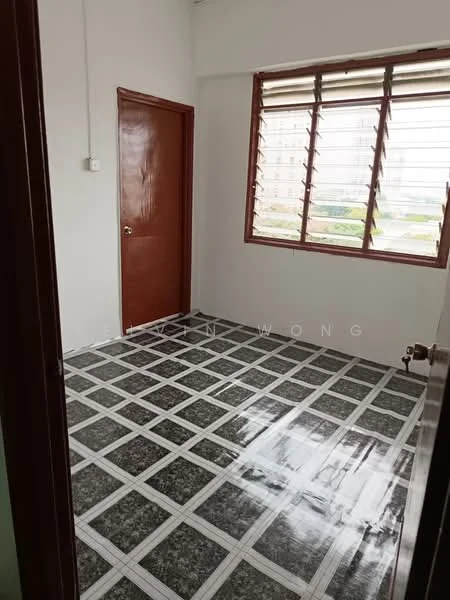 Room features: white painted walls, brown wooden door, sliding windows with horizontal bars, grey and white tiled flooring, natural light from window, view of greenery outside; view: garden.