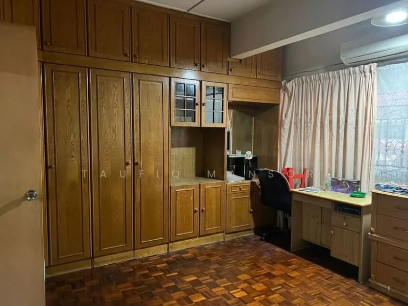 Study features: wooden cabinetry with glass-front upper cabinets, built-in desk, black office chair, wooden parquet flooring, window with sheer curtains, wall-mounted air conditioning unit, decorative wall paneling, multiple shelves; style: traditional.