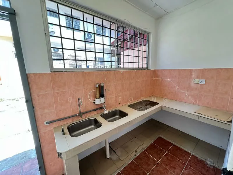 Kitchen features: two-bowl stainless-steel sink, chrome pull-down faucet, white laminate countertop, pink tiled backsplash, pink tiled walls, brown ceramic tile flooring, window with security bars, open shelving, built-in cabinetry, utility area.