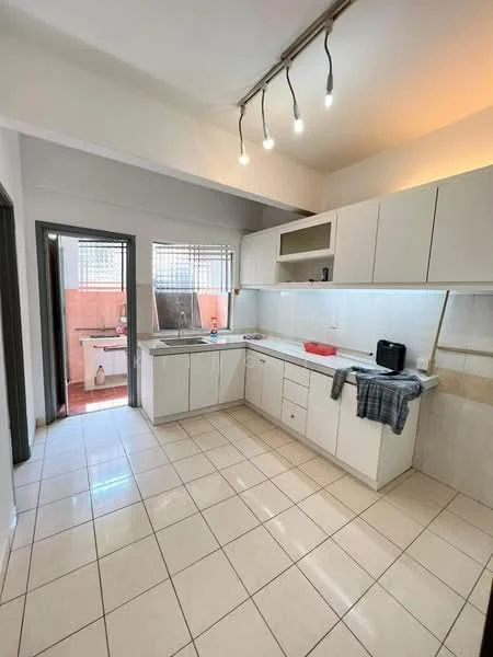 Kitchen features: L-shaped kitchen layout, white cabinetry, grey countertop, single-bowl stainless-steel sink, chrome pull-down faucet, built-in oven, freestanding microwave, tile backsplash, ceramic tile flooring, recessed downlights, window with grid pattern, open shelving above countertop, wall-mounted cabinets; style: modern.