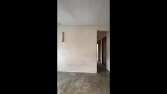Room features: unfinished walls, concrete flooring, open layout, doorway leading to another room, natural light from adjacent openings.